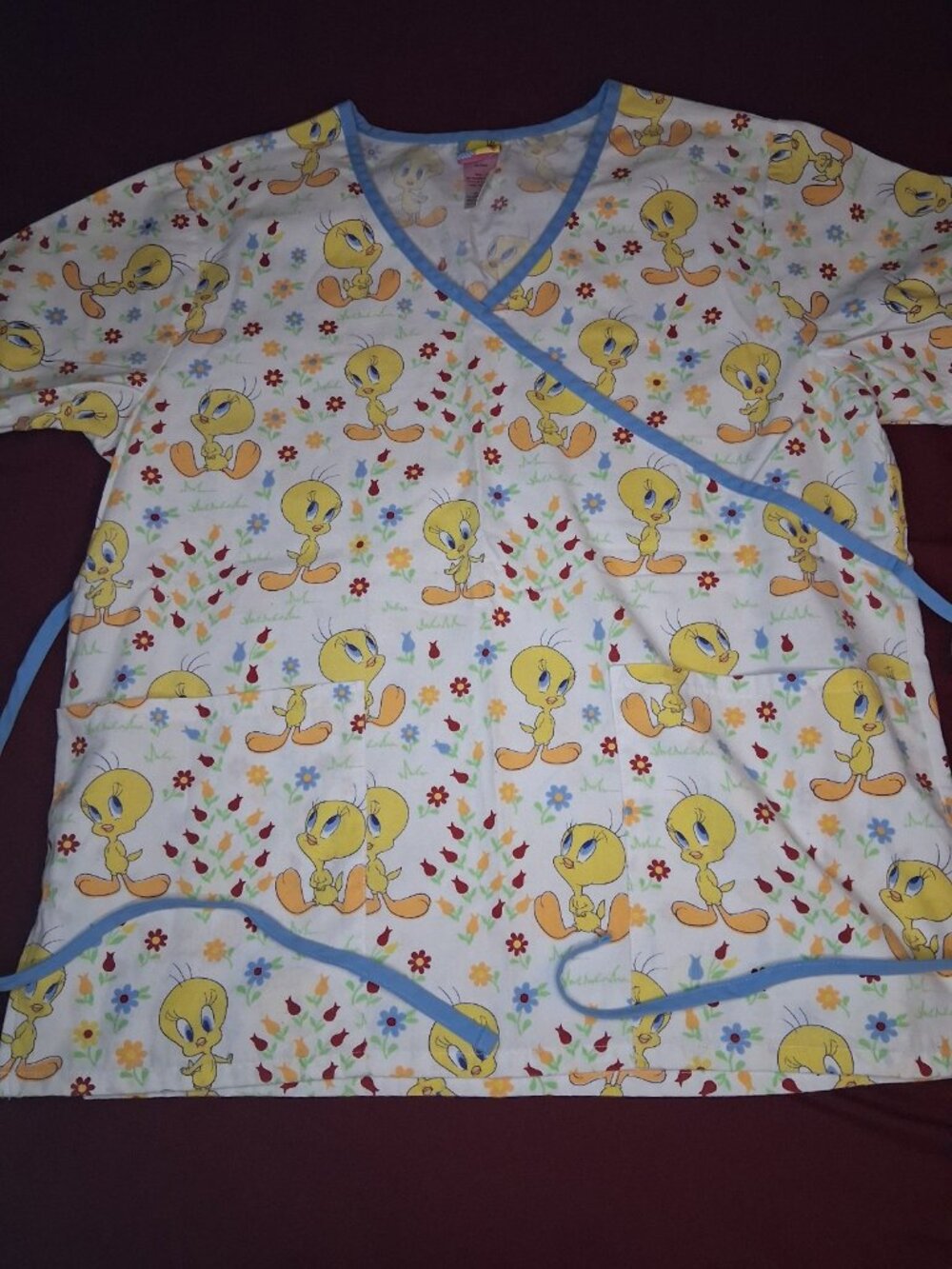 Tweety Bird Scrubs with yellow Tweety Bird characters and small flowers size S
